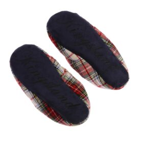 A pair of slippers with plaid and blue soles.
