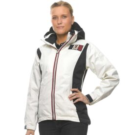 A woman in white jacket posing for the camera.