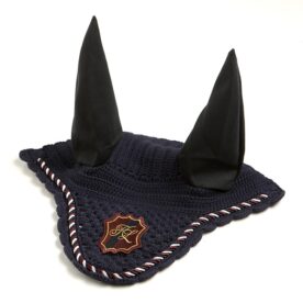 A black and white horse 's ear cover with a red ribbon.