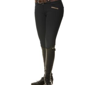 A woman wearing black pants and boots