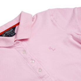 A close up of the collar on a pink polo shirt