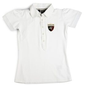 A white polo shirt with a patch on the chest.