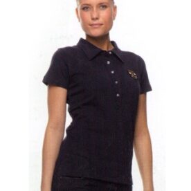 A woman in black shirt standing next to wall.