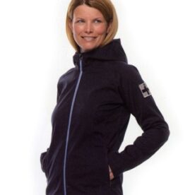 A woman wearing a black jacket with blue trim.