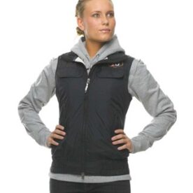 A woman standing with her hands on hips.