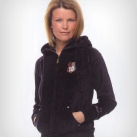 A woman wearing a black jacket with a hood.