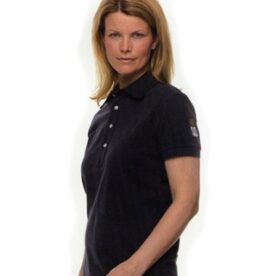 A woman wearing a black polo shirt and standing.