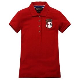 A red polo shirt with a patch on the chest.