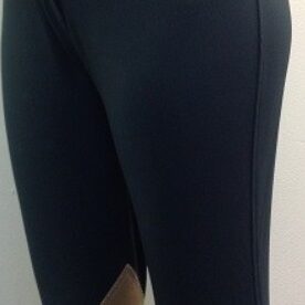 A pair of black pants with tan and white stripes.