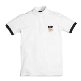 A white polo shirt with black trim and an embroidered patch.