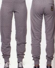 A pair of grey sweatpants with a patch on the back.