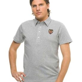 A man wearing a gray polo shirt with a crest on the chest.