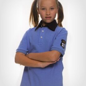 A girl with her arms crossed wearing a blue polo shirt.