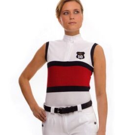 A woman in white and red shirt standing next to a wall.