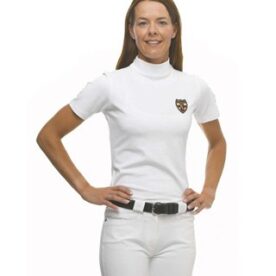 A woman in white shirt and pants standing with hands on hips.