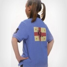 A girl with her hands on the back of her hips.